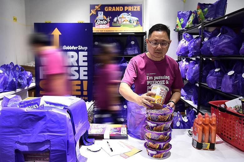Mr Loo Poh Thye, 52, who suffered a stroke two years ago, now works part-time with social enterprise GobblerCo, packing and distributing groceries.