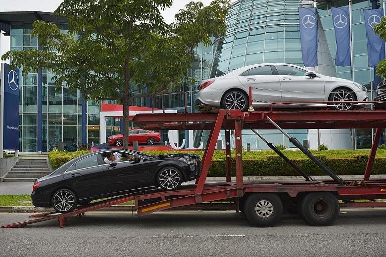 A car being offloaded outside the showroom of Mercedes-Benz distributor Jardine Cycle & Carriage in Alexandra Road. Jardine Matheson runs Mercedes-Benz dealerships, among other things.