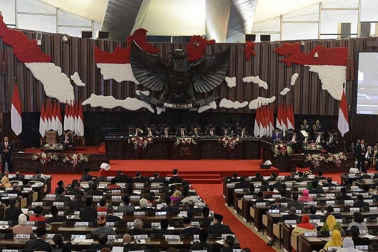 Indonesian President Joko Widodo, who was re-elected in the April 17 polls, giving his speech in Parliament yesterday, detailing the government's proposed 2020 state budget.