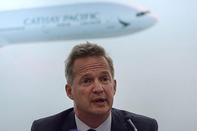 Mr Rupert Hogg's resignation came after Beijing criticised Cathay for not doing enough to rein in staff who backed protesters. PHOTO: AGENCE FRANCE-PRESSE