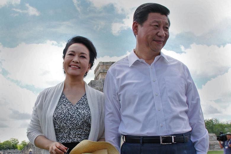 Chinese President Xi Jinping and his wife Peng Liyuan at the Chichen Itza archaeological site in Mexico's Yucatan state in 2013. Details about Mr Xi's marriage were revealed in two articles in Chinese state media.