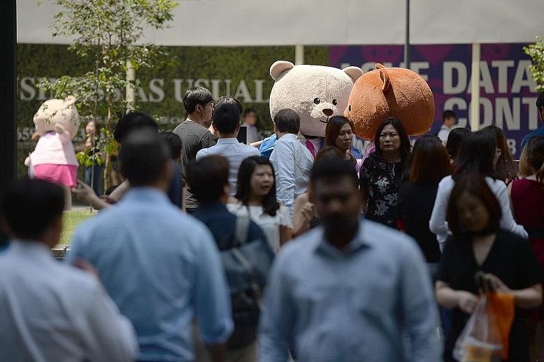 Life-size teddy bears at Raffles Place Park on Aug 1 as part of a campaign by Workforce Singapore to highlight programmes to help Singaporeans take on new jobs. Lower trade volumes and dampened demand from the US and China could impact Singapore firm