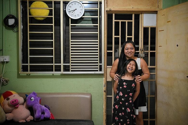Receptionist Rachel Hong and her daughter Faith, who received help from the Circle of Care programme, at their Lengkok Bahru rental flat. Ms Hong says she has seen the 10-year-old improve by leaps and bounds.