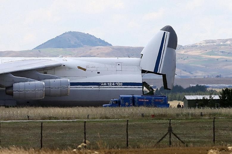 A Russian military cargo plane carrying the S-400 missile defence system being unloaded in Ankara last month. The US has expressed concerns over Turkey's purchase jeopardising the security of Nato's new F-35 jet.