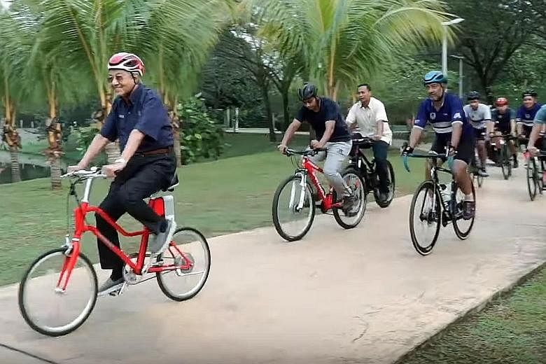A screengrab from a video showing Malaysian Prime Minister Mahathir Mohamad cycling with an entourage of nearly 10 men around parks in Putrajaya and Cyberjaya at the weekend. Tun Dr Mahathir, who is in his second stint as premier, celebrated his 94th