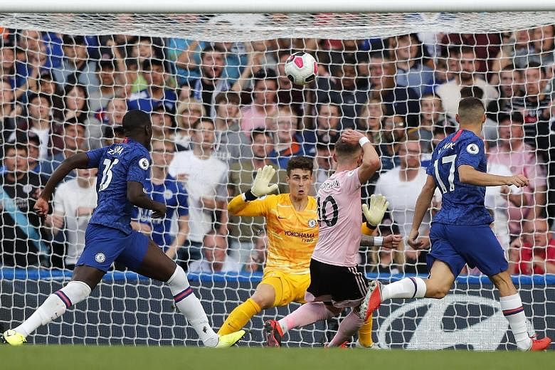 Leicester's James Maddison (centre) fails to score at point-blank range in front of Chelsea goalkeeper Kepa Arrizabalaga in the 1-1 Premier League stalemate between the two sides at Stamford Bridge on Sunday, stretching Frank Lampard's winless tenure