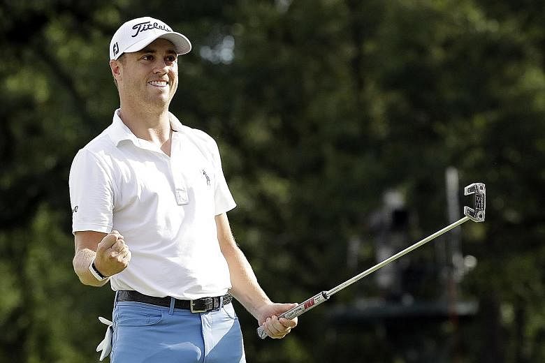 Justin Thomas celebrating his birdie on the 18th to wrap up a three-shot victory, his first title in a year, in the BMW Championship at Medinah Country Club on Sunday. PHOTO: ASSOCIATED PRESS