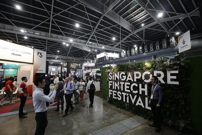 Last year's Singapore FinTech Festival at the Singapore Expo. The fintech industry here is estimated to employ 6,500 to 10,000 people, based on the extrapolated results of a survey this year by the Singapore FinTech Association and audit firm PwC Sin