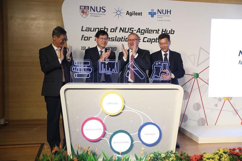 (From far left) Professor Tan Eng Chye, president of National University of Singapore; Associate Professor Benjamin Ong, the Ministry of Health's director of medical services; Mr Mike McMullen, president and chief executive of Agilent Technologies; a