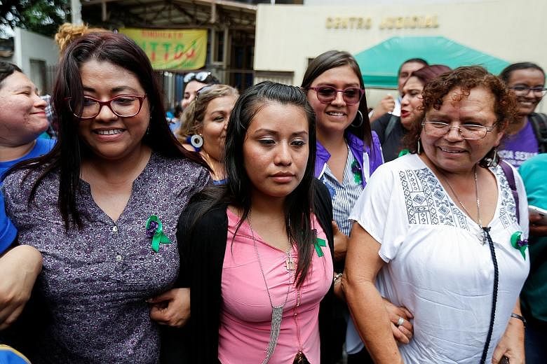 Ms Evelyn Hernandez (in pink), who has already served three years of a 30-year sentence for intentionally inducing an abortion, was freed on Monday by a court in El Salvador.