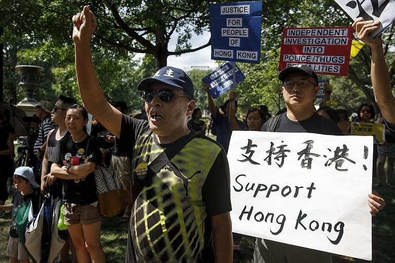 People rallying in front of the White House in Washington on Sunday to show solidarity with protesters in Hong Kong. Twitter said on Monday that it has suspended more than 200,000 accounts that it believes were part of a Chinese government influence 