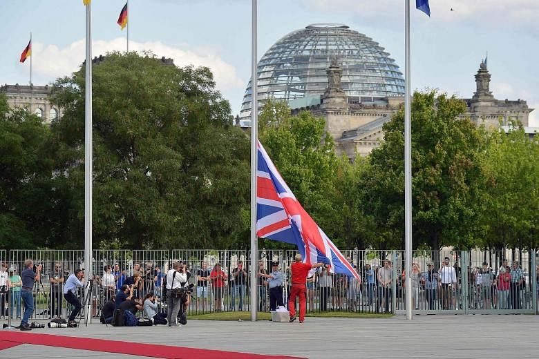The Union Jack being raised ahead of the visit of British Prime Minister Boris Johnson at the Chancellery in Berlin yesterday. Mr Johnson is visiting Berlin to kick off a marathon of tense talks with key European and international leaders as the thre