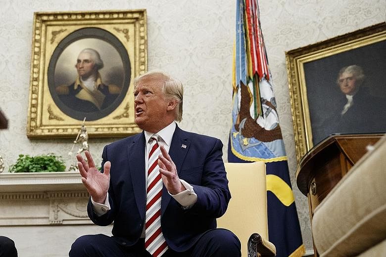 US President Donald Trump speaking to reporters at the White House on Tuesday. The US leader's 2020 bid for a second term hinges on the economy's performance. PHOTO: ASSOCIATED PRESS
