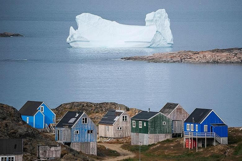 The town of Kulusuk in Greenland, a Danish self-governed territory. Referring to how US President Donald Trump recently scrapped a planned state visit to Denmark after being told that Greenland was not for sale, the writer says it is beyond the absur