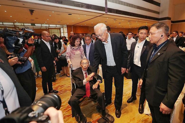 Emeritus Senior Minister Goh Chok Tong greeting Mr Chiam See Tong at last night's Chiam See Tong Sports Fund gala dinner. Mr Chiam made a surprise appearance midway through the event when he was wheeled in by his wife Lina. Also there to greet Mr Chi