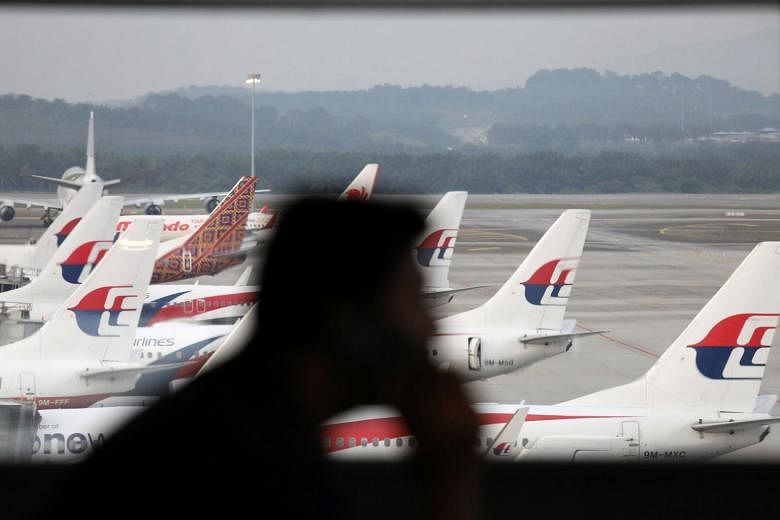 Kuala Lumpur airport replaces faulty equipment but still experiences