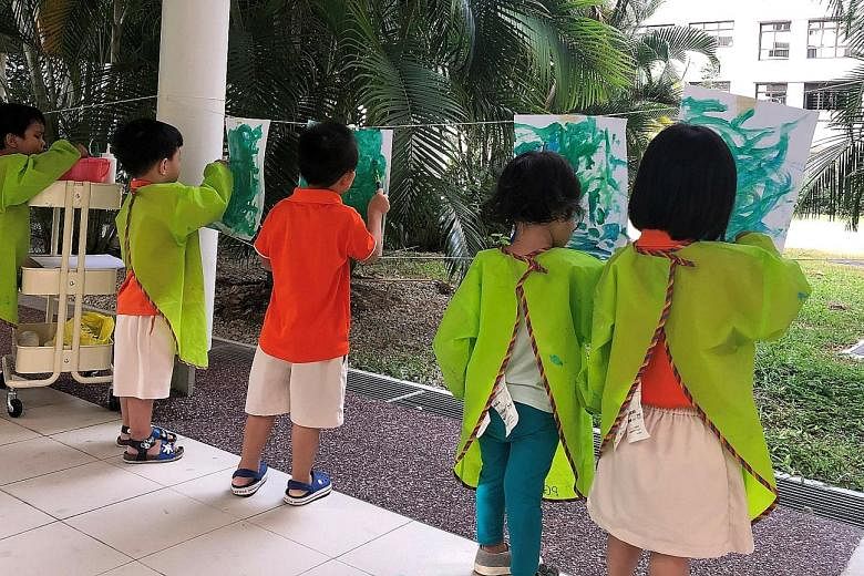 My First Skool pre-schoolers taking part in a drawing activity. The operator has 143 centres here. Children at a 30-minute NeuroMooves class at MindChamps PreSchool @ Toa Payoh. The operator's trademarked programmes are a big draw. ST PHOTO: TIMOTHY 
