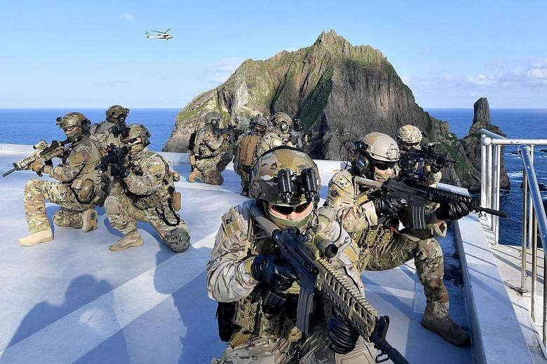 South Korean troops taking part in a military drill yesterday around disputed remote islands called Dokdo in Korean and Takeshima in Japanese.