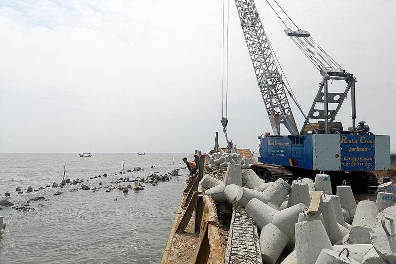Breakwaters have been placed about 2km from North Jakarta's shores to help coastal residents, many of whom are traditional fishermen or poor families.
