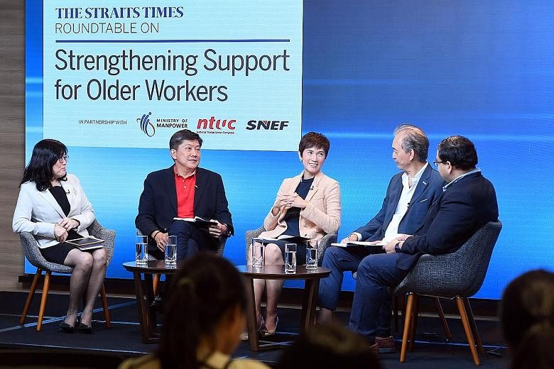 At the round-table discussion last Friday were (from left) Associate Professor Chia Ngee Choon, National Trades Union Congress secretary-general Ng Chee Meng, Manpower Minister Josephine Teo, Singapore National Employers Federation president Robert Y