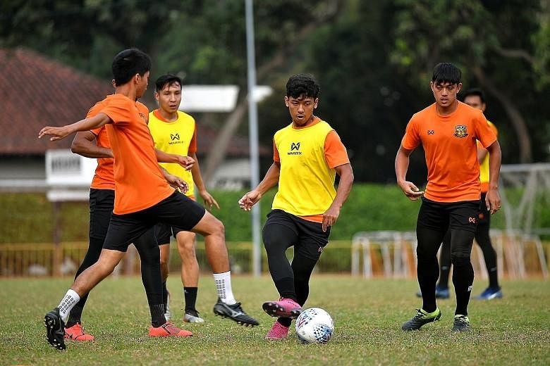 Midfielder Mahathir Azeman (centre) is back in action for Hougang United in the Singapore Premier League after suffering four knee injuries. 