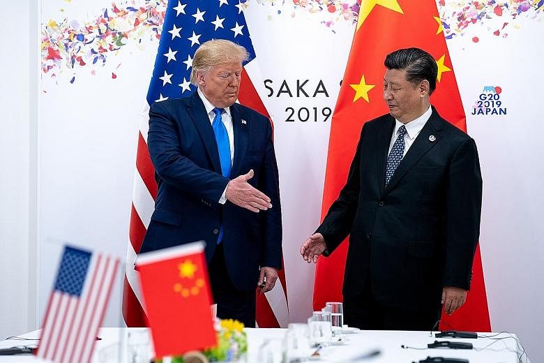 US President Donald Trump and Chinese President Xi Jinping at the G-20 summit in Osaka, Japan, in this file photo taken on June 29. Tensions between the world's two biggest economies have escalated in recent days, after both sides announced new tarif