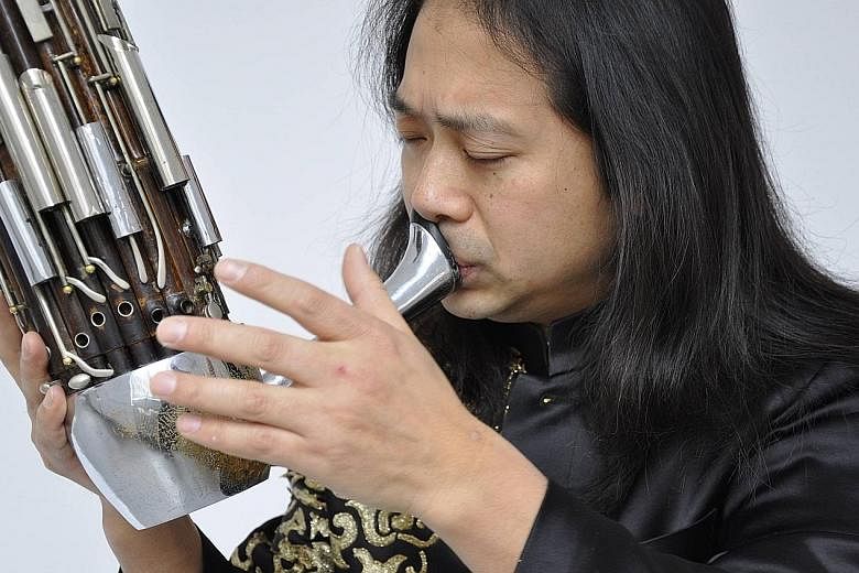 Sheng virtuoso Wu Wei (above) will take centre stage in the Earth & Fire sheng concerto while The Butterfly Lovers' Violin Concerto will feature violinist Kam Ning.