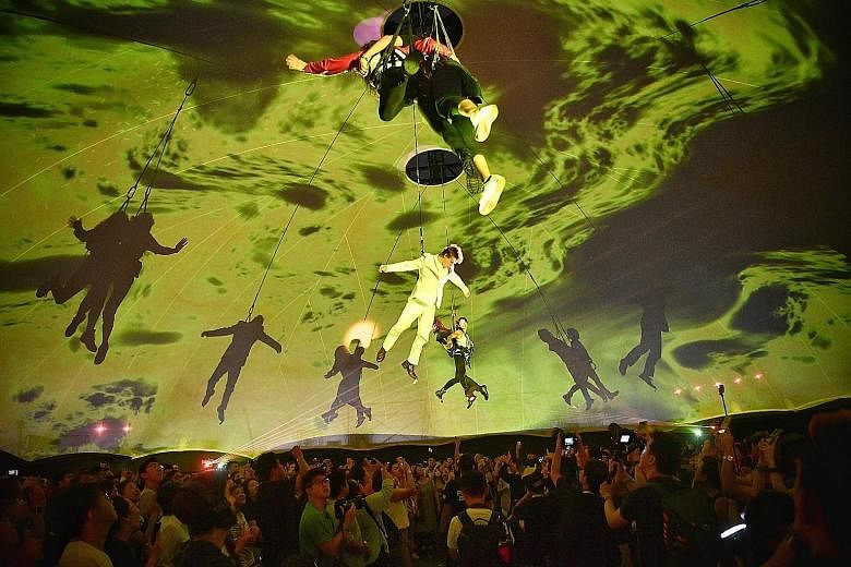 Renowned Argentinian troupe Fuerza Bruta performing during a preview at Cathay Green last night. The group headlines this year's edition of the Singapore Night Festival. Fuerza Bruta, which means brute force in Spanish, features dancers suspended abo