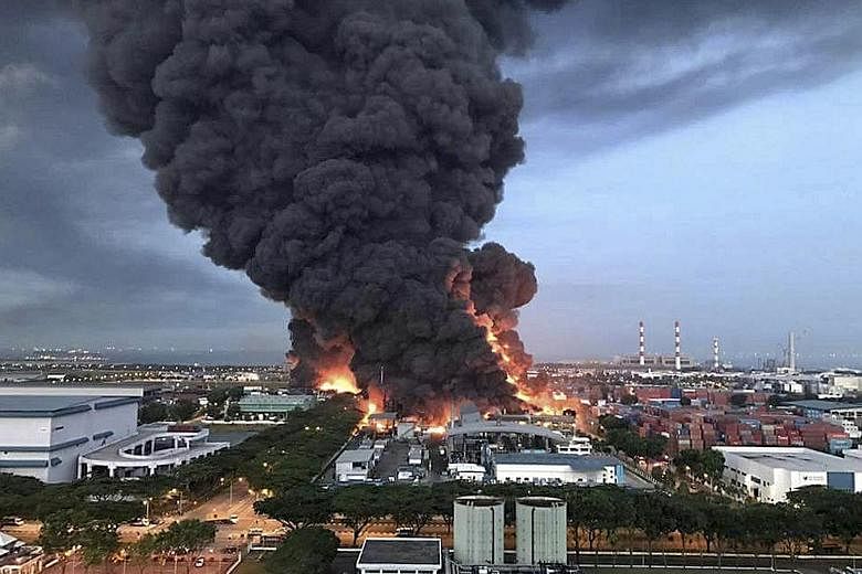 The fire at Eco Special Waste Management's Tuas plant on Feb 23, 2017. It broke out when a worker was discharging recovered liquid hexane from a product tank into a plastic intermediate bulk container.
