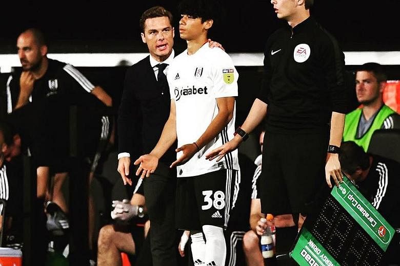Ben Davis, 18, receiving instructions from manager Scott Parker before coming on against Southampton in the League Cup. It was the teenager's first senior appearance for Championship side Fulham. PHOTO: INSTAGRAM/ BEN_JAMES_DAVIS