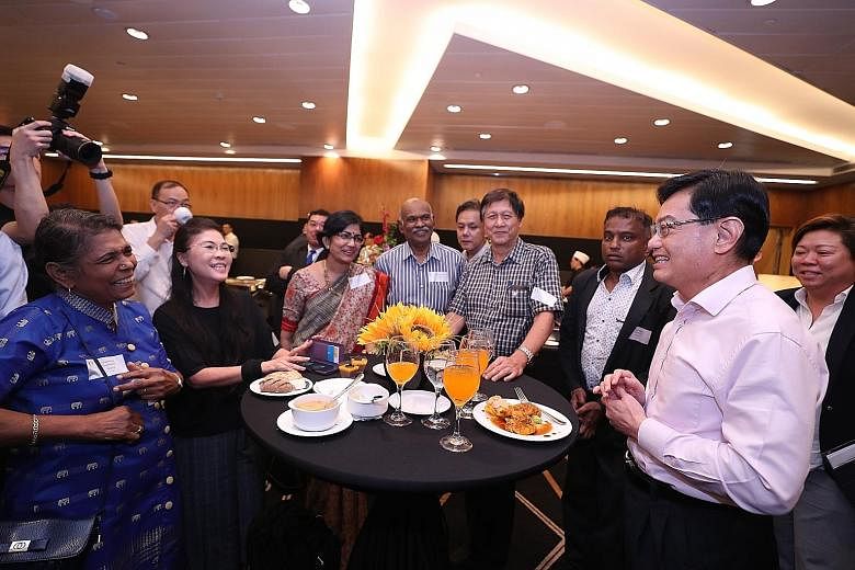 Deputy Prime Minister Heng Swee Keat mingling with participants before a closed-door dialogue organised by government feedback unit Reach yesterday. ST PHOTO: TIMOTHY DAVID