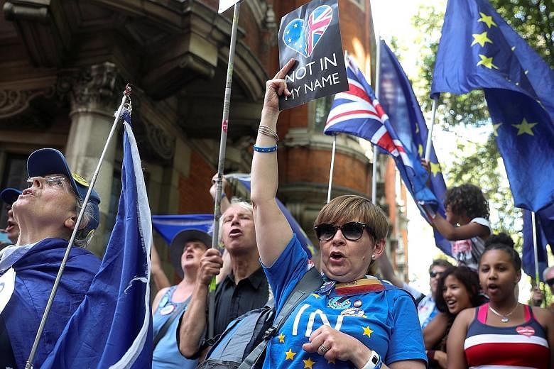 Anti-Brexit protesters outside Westminster in London yesterday. The decision to suspend Parliament has outraged critics and is serving as a unifying force for the disparate opposition, who have confirmed they will press on with measures to block leav