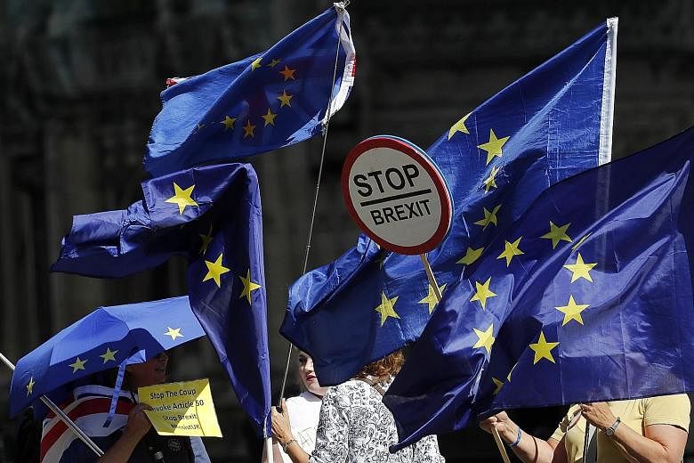 Anti-Brexit protesters outside Britain's Parliament in London on Thursday. Mr Boris Johnson's decision to prorogue Parliament now with the express intention of ensuring that a minority government's view prevails over the will of Parliament - and on t