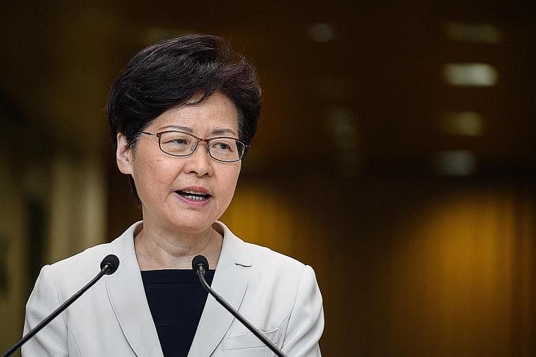 Hong Kong Chief Executive Carrie Lam speaking at a press conference on Tuesday. Beijing had told Mrs Lam not to withdraw the Bill, or to launch an inquiry into the tumult, including allegations of excessive police force, according to a senior governm