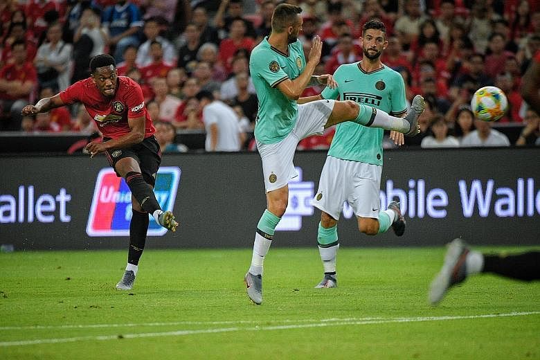 Anthony Martial, taking a shot against Inter Milan in Singapore in July, will bear a heavier striking burden with forwards Alexis Sanchez and Romelu Lukaku leaving for Italy. 