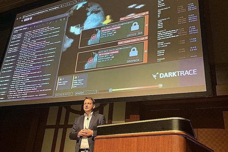 Darktrace's director of technology Dave Palmer speaking on Aug 5 at the Gartner Security and Risk Management Summit in Tokyo.