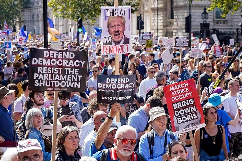 Demonstrators outside Prime Minister Boris Johnson's office in Downing Street yesterday protesting against the move to suspend Parliament in the final weeks before Brexit.