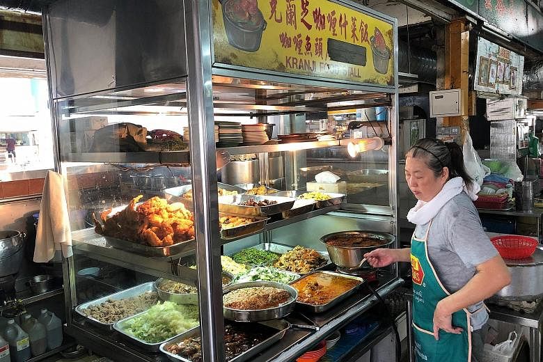 At Kranji Food Stall operated by Madam Wendy Koh (above), a plate of rice with a fried chicken drumstick and two vegetable dishes costs $3.30. 