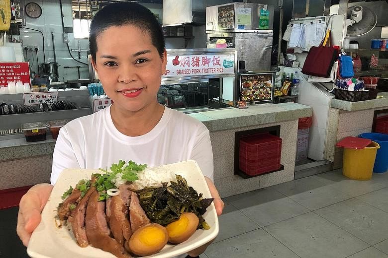 Stall owner Nachatchadaporn Sirimueang whips up a mean Thai Braised Pork Trotter Rice dish that costs only $5. 