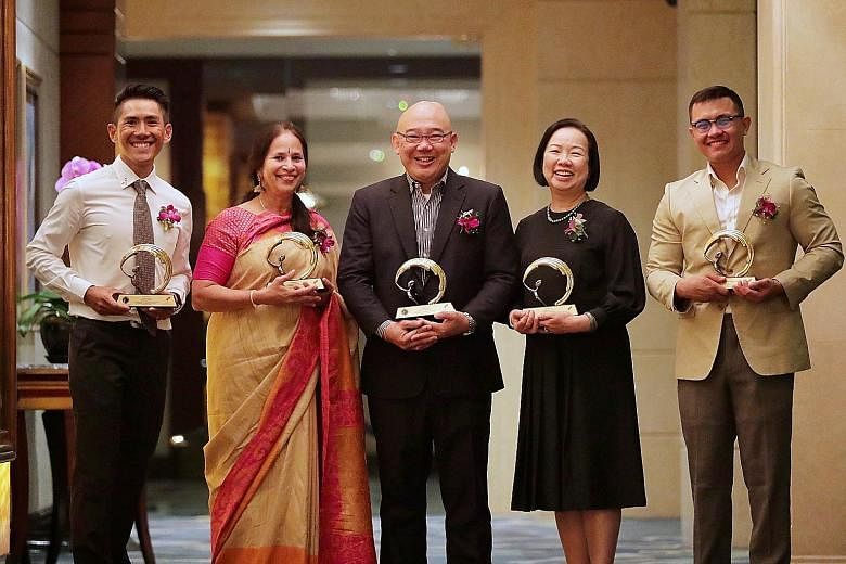 (From far left) Mr Jeremy Tong, Dr Bhavani Sriram, Mr Foo Say Thye, Madam Rowena Leong and Mr Aminur Rasyid Mohamed Anwar were the five winners of the Silent Heroes Awards conferred by the Civilians Association of Singapore yesterday. 