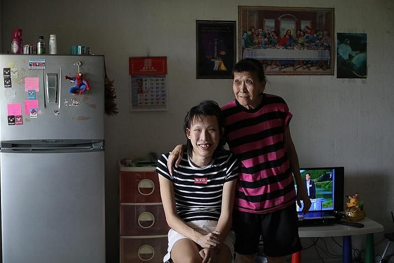 Single mother Tan Lye Han and her son Kevin Ong are among those helped by Mr Lye, who read about their plight in The Straits Times.