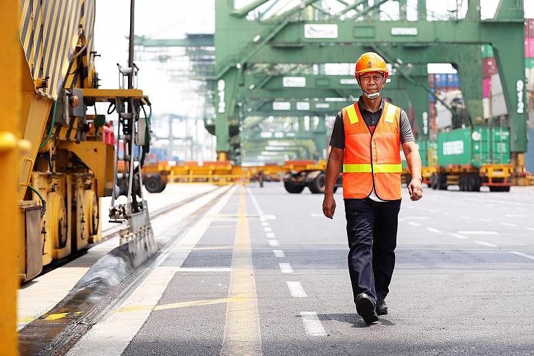 Crane operator Suliman Basri has worked for port operator PSA for the last 31 years, mostly at Brani Terminal on Pulau Brani. He has offered to work at Tuas Terminal when Brani operations eventually move there.