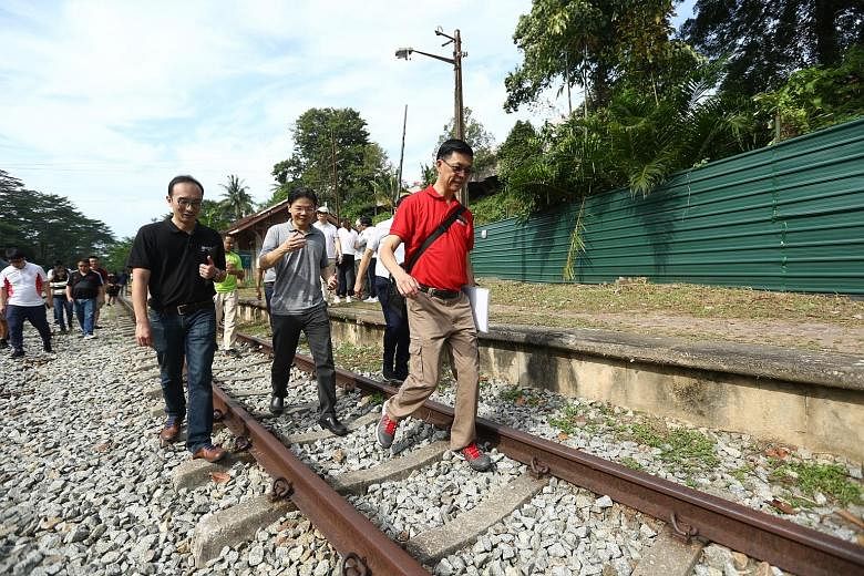 (From left) Architectural historian and conservator Yeo Kang Shua, National Development Minister Lawrence Wong and the Urban Redevelopment Authority's director of projects Teo Chong Yean at the Bukit Timah Railway Station yesterday.