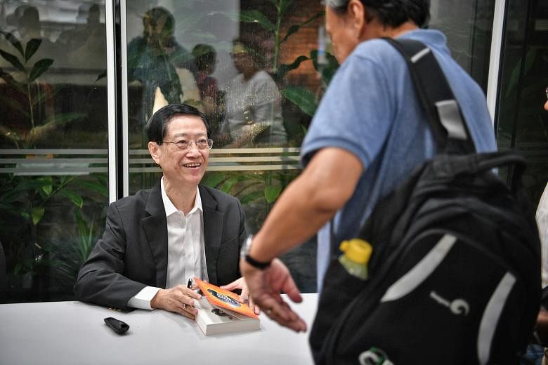 Author Soo Kok Leng signing his book, Think Wits Wins: How To Use Sun Zi's Art Of War For Success, at The Straits Times Book Club session at National Library. He says that in an enterprise, the leader's Dao - "The Way of Moral Authority" - is manifes