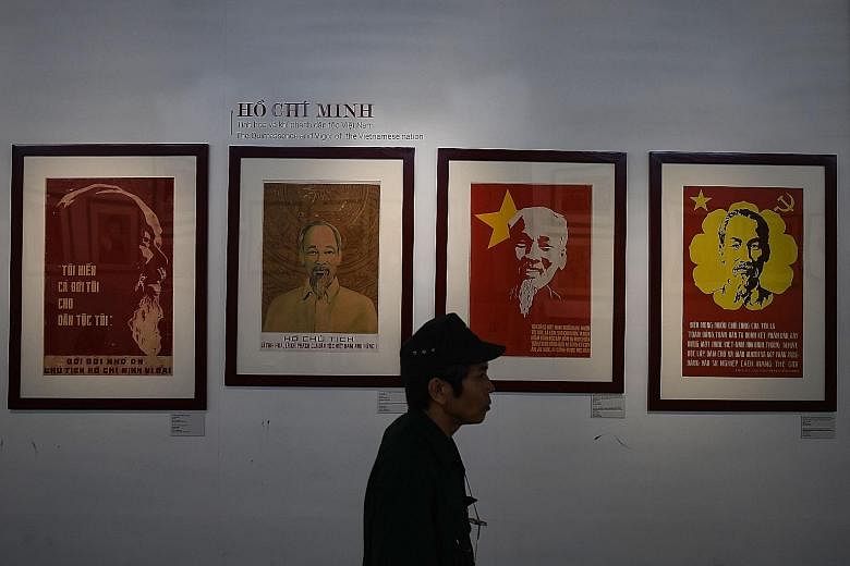 Posters of Vietnam's revolutionary leader Ho Chi Minh at the Ho Chi Minh Museum in Hanoi. Protecting Ho's embalmed body is the ultimate patriotic service for the guards at his tomb in Hanoi, a monolithic shrine to a man who still pervades public life