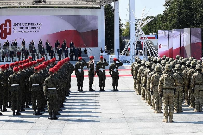 Heads of state and officials at a military ceremony, part of commemorations marking 80 years since the outbreak of World War II, at Pilsudski Square in Warsaw, Poland, yesterday. Poland lost about a fifth of its population, including the vast majorit