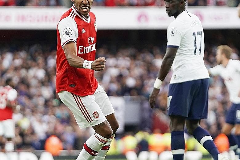 Top: Pierre-Emerick Aubameyang celebrating Arsenal's equaliser against Tottenham, his third goal in the Premier League this season. Arsenal's Granit Xhaka ploughing into Son Heung-min to give away a penalty that Harry Kane converted to put Spurs the 