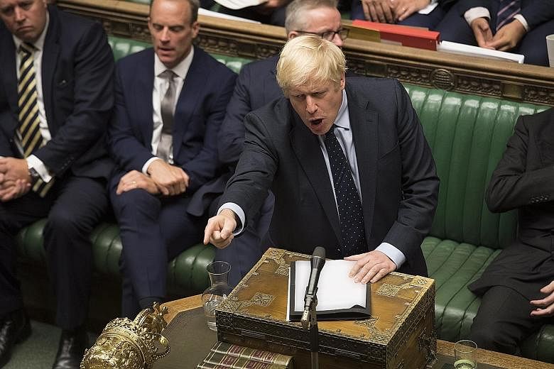 British Prime Minister Boris Johnson in the House of Commons in London on Tuesday. He is calling for an election next month after lawmakers seeking to prevent a no-deal Brexit dealt him a defeat in Parliament, which he cast as an attempt to surrender