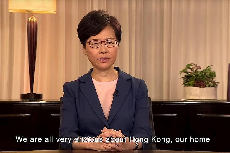 A screenshot from the televised video recording of Hong Kong Chief Executive Carrie Lam announcing that the government will move a motion to fully scrap the extradition Bill. She also said her administration will pave the way for dialogue, and called