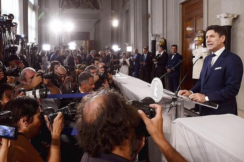 Italy's Prime Minister Giuseppe Conte reading out the list of ministers who will form his new Cabinet, drawn primarily from the 5-Star Movement and Democratic Party, after a meeting with Italian President Sergio Mattarella at the Quirinale Presidenti
